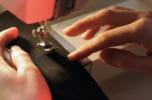 12511088 - tailor at work on sewing machine